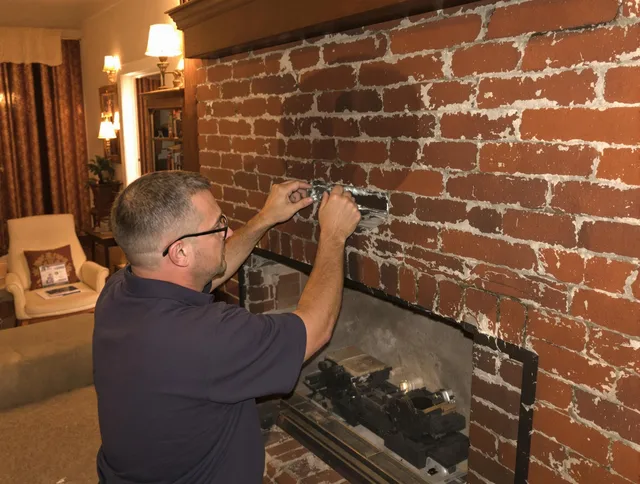 Montebello Chimney Sweep expert fixing a fireplace in Montebello, CA